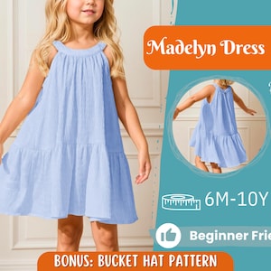 Può includere: Abito Madelyn azzurro per bambine, con scollatura all'americana e gonna a balze. L'immagine include anche una vista posteriore dell'abito, taglie 6M-10A, e il testo "Adatto ai principianti" e "Bonus: Modello cappello a secchiello".