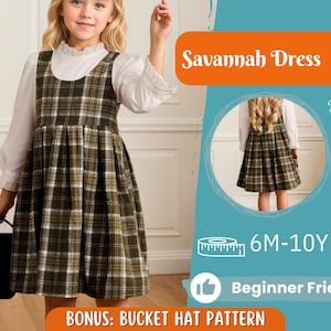 May include: A young girl wearing a green and white plaid Savannah dress with a white blouse underneath. The dress has a pleated skirt and is paired with a brown satchel. The image includes the text "Savannah Dress", "Back View", "6M-10Y", and "Beginner Friendly".
