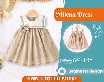Pode incluir: Um vestido Milena bege e branco para crianças, pendurado num cabide de madeira. O vestido apresenta um corpete branco com acabamentos bege e um laço, e uma saia bege com bolinhas. A imagem também inclui o texto "Milena Dress" e "Back View".