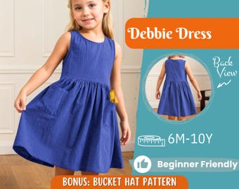 Pode incluir: Um vestido azul sem mangas com bolsos, usado por uma menina. A imagem inclui o texto "Debbie Dress", "Back View", "6M-10Y", "Beginner Friendly" e "BONUS: BUCKET HAT PATTERN".