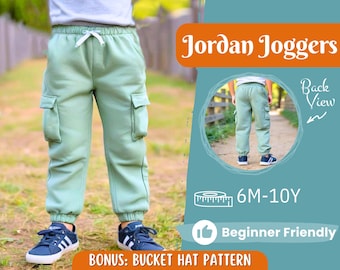 Może przedstawiać: Zielone spodnie dresowe Jordan z kieszeniami cargo. Spodnie są dla dzieci i mają sznurek do regulacji w pasie. Obraz zawiera tekst "Jordan Joggers", "Back View", "6M-10Y" i "Beginner Friendly".