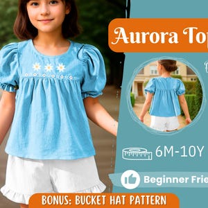 Puede incluir: Una blusa de mezclilla azul claro con flores blancas bordadas y mangas abullonadas. La blusa es para niñas y tiene una imagen de vista posterior. El texto "Aurora Top" está en naranja sobre un fondo azul claro. El texto "6M-10Y" está en blanco sobre un fondo azul claro. El texto "Beginner Friendly" está en blanco sobre un fondo azul claro. El texto "BONUS: BUCKET HAT PATTERN" está en negro sobre un fondo azul claro.
