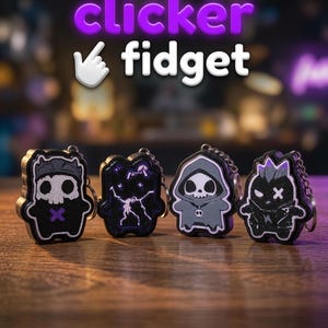 May include: Four black and purple character-shaped clicker fidget keychains with skull and lightning designs. The text "clicker fidget" with a white hand cursor icon is displayed above the items, which feature metallic key rings attached.