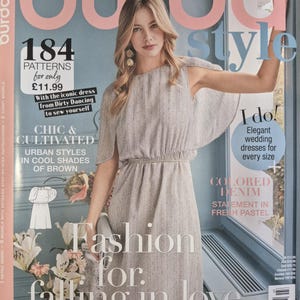 May include: A magazine cover featuring a woman in a light-colored dress. The cover includes text that reads "Burda Style" and "Fashion for falling in love." Additional text promotes patterns and wedding dresses.