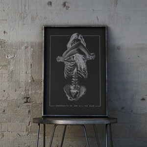 May include: A black and white illustration of a skeleton with a woman's body superimposed on top. The text "UNDERNEATH WE ARE ALL THE SAME" is at the bottom of the image.