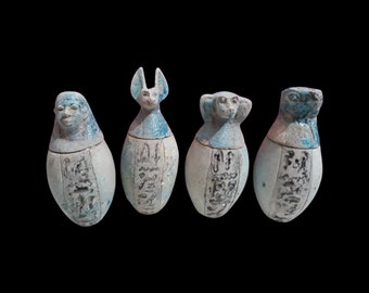 A very unique set of Canopic jars hand carved from porcelain stone made in Egypt natural color fiery coloring