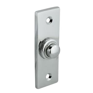 May include: A chrome doorbell button with a round, raised button. The button is mounted on a rectangular plate.