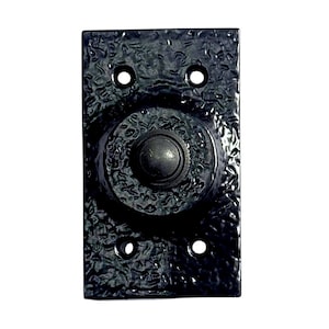 May include: Black doorbell button with a textured finish and a round, raised button in the centre.
