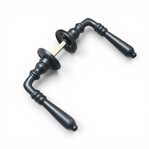 May include: A pair of matte black door handles featuring a curved, tapered design with ribbed detailing on the neck. The handles are connected by a central metal spindle and include two circular mounting plates with visible screw holes for installation.