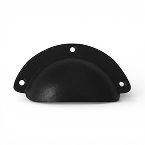May include: A black, half-moon shaped cabinet pull with three pre-drilled holes for mounting. The hardware has a matte finish and a rounded, cup-like design. Suitable for drawers and cabinets.