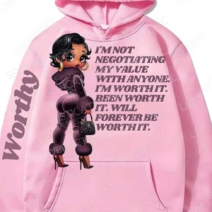 May include: Pink hoodie with a cartoon illustration of a woman with a purse and the text "I'm not negotiating my value with anyone. I'm worth it. Been worth it. Will forever be worth it."