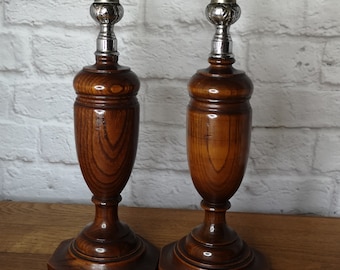 Vintage oak candlesticks with metal top.