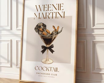 May include: A framed wall art print featuring a dapple dachshund sitting inside a martini glass. The text reads WEENIE MARTINI, COCKTAIL, DACHSHUND CLUB, and BEVERLY HILLS, CALIFORNIA. The glass is adorned with a black bow tie.