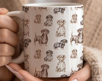 May include: White ceramic mug featuring a repeating pattern of dachshund illustrations in various poses and colors. The dachshunds are depicted in shades of brown, black, and tan. The mug has a white handle and a glossy finish.