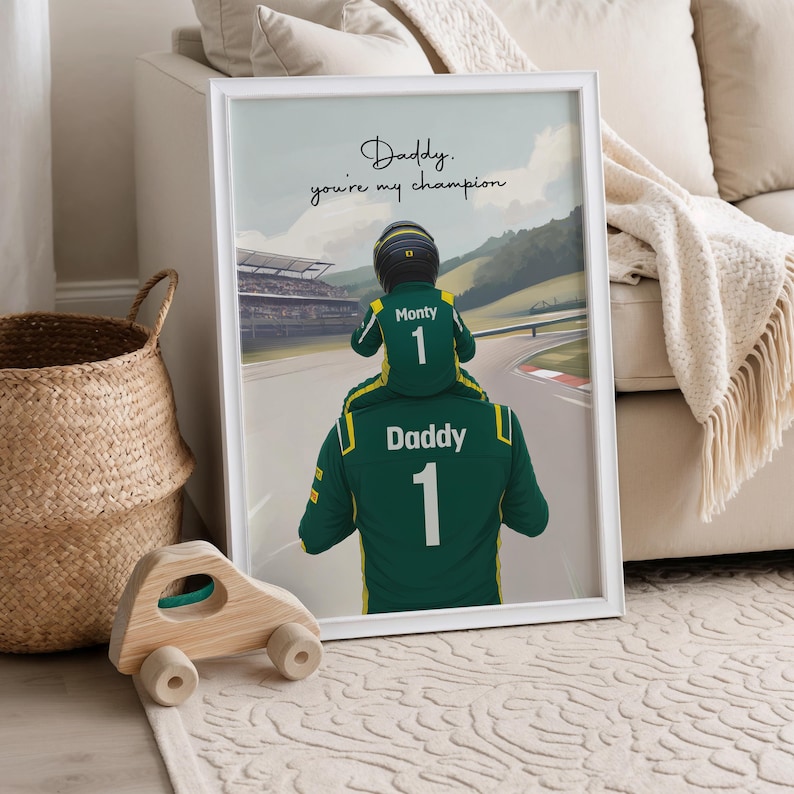 May include: A framed print featuring an illustration of a child wearing a racing helmet sitting on the shoulders of an adult. Both wear green racing suits with the number 1. The text reads, Daddy. you're my champion. The background shows a racetrack.