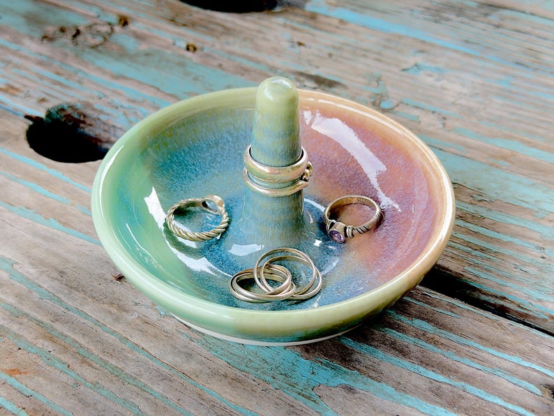 Handmade ceramic ring holder featuring flowing glaze and natural color variation, pottery jewelry holder with glossy surface and unique finish. Pictured here Ocean Sunset glaze option.