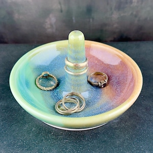 Handmade ceramic ring holder featuring flowing glaze and natural color variation, pottery jewelry holder with glossy surface and unique finish. Pictured here Ocean Sunset glaze option.