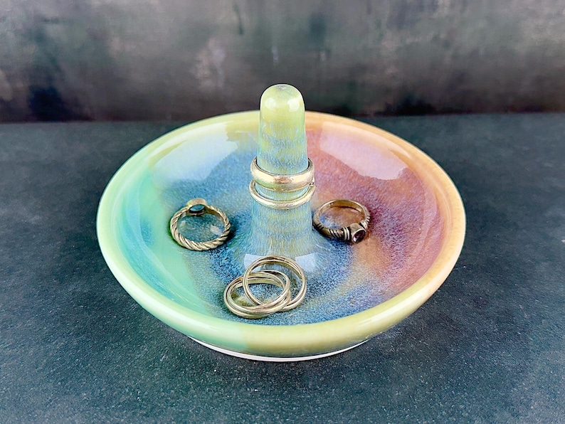 Handmade ceramic ring holder featuring flowing glaze and natural color variation, pottery jewelry holder with glossy surface and unique finish. Pictured here Ocean Sunset glaze option.