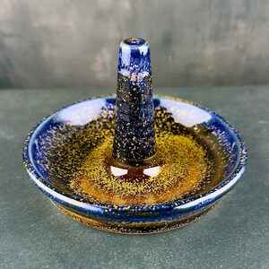 Handmade ceramic ring holder featuring flowing glaze and natural color variation, pottery jewelry holder with glossy surface and unique finish. Pictured here Starry Midnight glaze option.