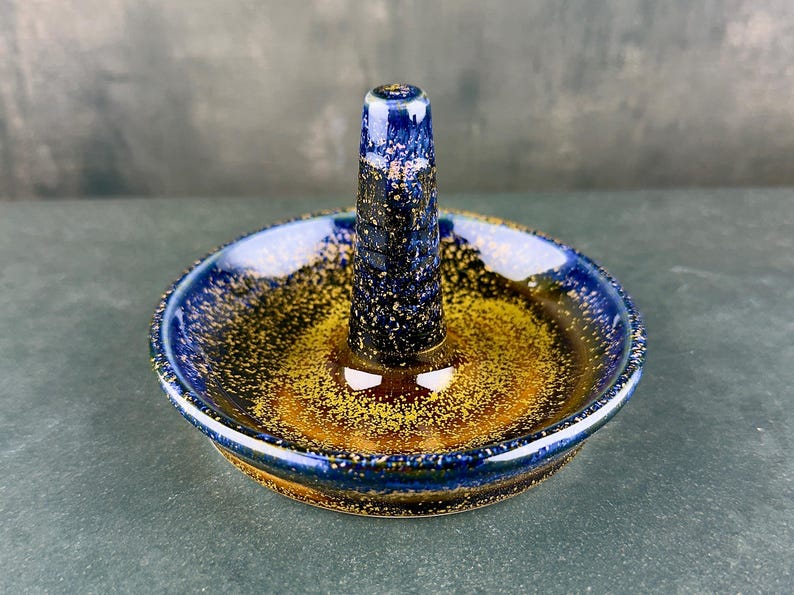 Handmade ceramic ring holder featuring flowing glaze and natural color variation, pottery jewelry holder with glossy surface and unique finish. Pictured here Starry Midnight glaze option.