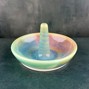 Handmade ceramic ring holder featuring flowing glaze and natural color variation, pottery jewelry holder with glossy surface and unique finish. Pictured here Ocean Sunset glaze option.