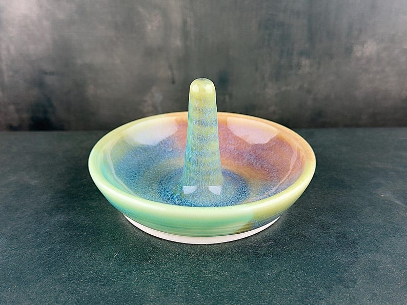 Handmade ceramic ring holder featuring flowing glaze and natural color variation, pottery jewelry holder with glossy surface and unique finish. Pictured here Ocean Sunset glaze option.
