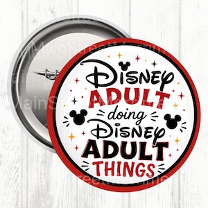 May include: A round pin-back button with a white background, a red border, and black and red text that reads Disney ADULT doing Disney ADULT THINGS. The design includes black Mickey Mouse head silhouettes and small red and gold star accents.