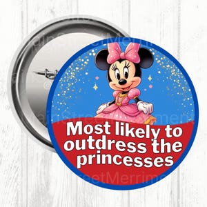 May include: A circular badge with Minnie Mouse in a pink dress and bow, and the text "Most likely to outdress the princesses". The design is on a blue and red background, with a silver pin.