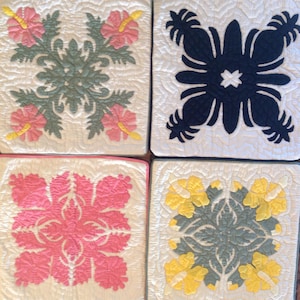 May include: Four square fabric panels with different floral designs. The top left panel features a green floral design with pink flowers. The top right panel features a black floral design. The bottom left panel features a pink floral design. The bottom right panel features a yellow floral design.