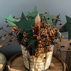Primitive Style Tabletop Decor with Stars, Pip Berry Branches, and Grungy Battery-Operated Candle