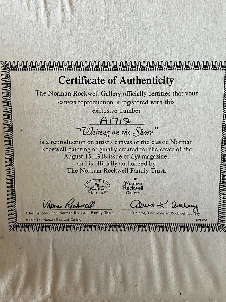 May include: Certificate of Authenticity for a canvas reproduction of Norman Rockwell's "Waiting on the Shore" painting. The certificate is signed by the administrator and director of the Norman Rockwell Gallery and includes the registration number A1712.