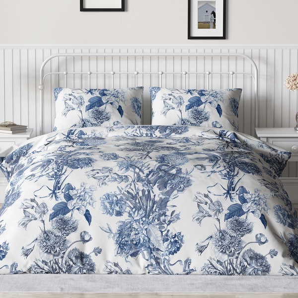 Blue toile bedding, a shabby chic cotton duvet cover, that is luxuriously designed with vintage style flowers in shades of royal blue.