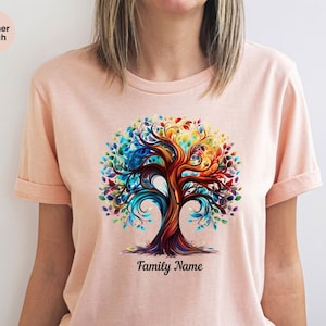 May include: A pink t-shirt with a colorful tree design and the text "Family Name" printed below the tree.