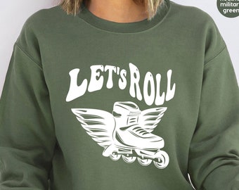 May include: A green sweatshirt with the text "LET'S ROLL" in white, featuring a white roller skate with wings.