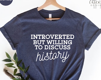 May include: A heather mid navy blue t-shirt with the text "Introverted but willing to discuss history" printed in white.