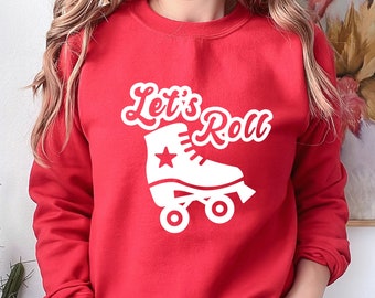 May include: Red sweatshirt with white text that says "Let's Roll" and a white roller skate graphic.