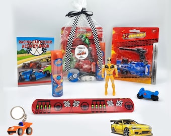 May include: A clear plastic bag filled with a variety of racing-themed party favors, including a sticker activity book, a small toy car, a keychain, a plastic toy race car, a plastic toy motorcycle, a plastic toy race car shooter, and a yellow plastic action figure. The bag is tied with a black and white checkered ribbon.