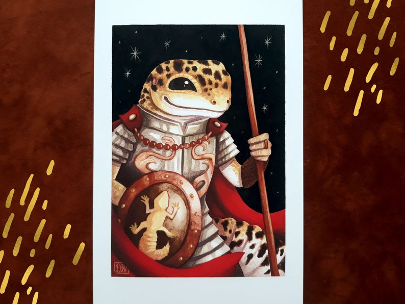 May include: A watercolor painting of a gecko wearing armor and holding a spear. The gecko is wearing a red cape and has a shield with a smaller gecko on it. The background is a dark blue with white stars.