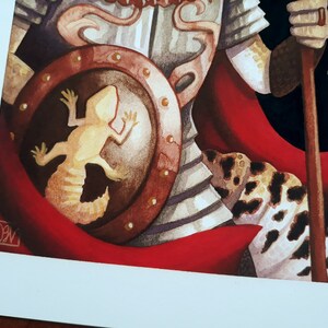 May include: A watercolor painting of a warrior wearing armor and a red cape. The warrior is holding a spear and has a shield with a lizard on it.