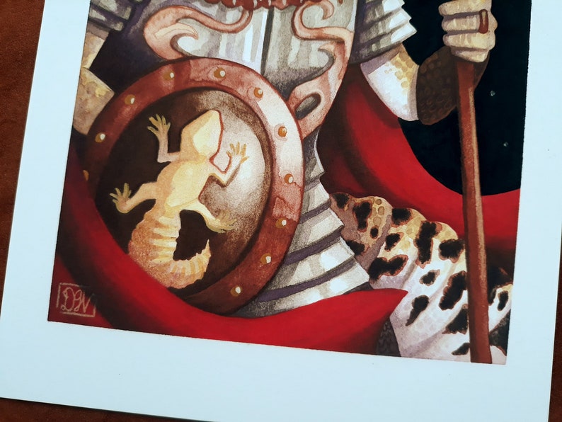 May include: A watercolor painting of a warrior wearing armor and a red cape. The warrior is holding a spear and has a shield with a lizard on it.