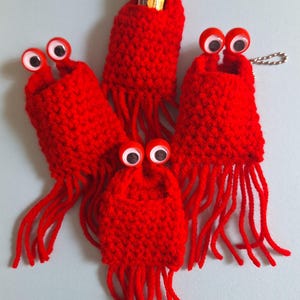 Yip Yips- Come with ball/bead chain. Approximately 3.5 x 2 inches.