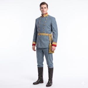 May include: A light blue double-breasted military-style jacket with gold buttons, a high collar with gold and red trim, and matching trousers. A gold sash with a long tassel hangs at the waist. The outfit is paired with tall black leather boots.