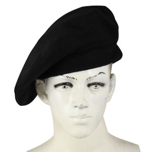 May include: A black beret made of wool.