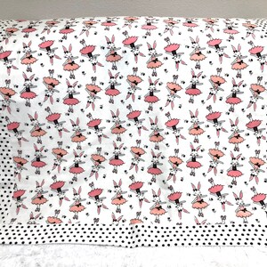 Snuggle Soft Baby Blanket with cute bunny ballerina print and black dot trimmed edges/ back panel.