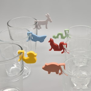 Set of 12 glass markers with animal motifs