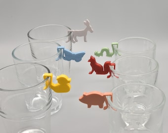 Set of 12 glass markers with animal motifs