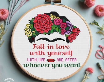 May include: Cross stitch pattern featuring a portrait of Frida Kahlo with a floral crown and the text "Fall in love with yourself with life and after whoever you want."