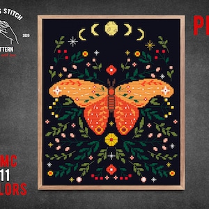 May include: Cross stitch pattern featuring a colorful butterfly with floral accents and a crescent moon design. The pattern is in a wooden frame and includes 11 DMC colors. PDF.