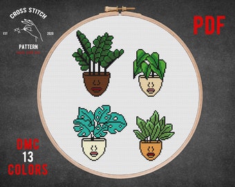 May include: Cross stitch pattern featuring four potted plants with faces. The plants are a monstera, a snake plant, a philodendron, and a succulent. The pattern is in PDF format and uses 13 DMC colors.