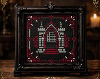 Pode incluir: Obra de arte em ponto cruz emoldurada, apresentando um desenho de arco gótico em vermelho, branco e preto. A obra de arte é exibida em uma moldura preta ornamentada. O texto "CROSS STITCH PATTERN" é visível na parte inferior.